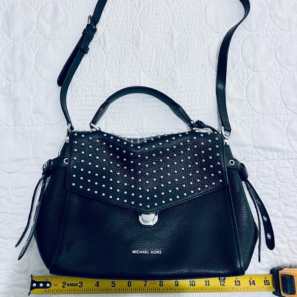 Michael Kors black leather with silver accents.